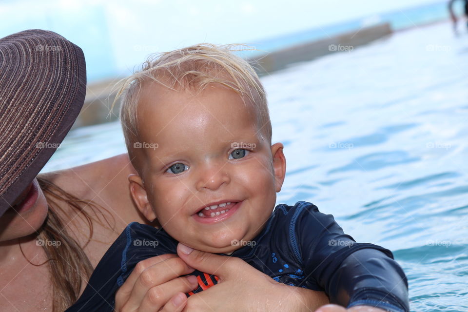 Cute baby boy having summer fun 