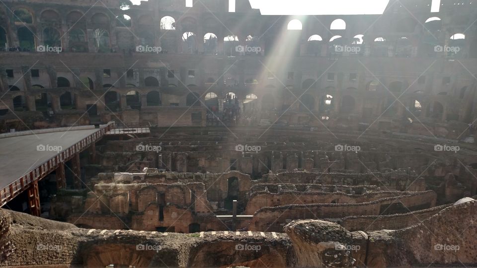 Colosseum on a sunny day. a ray of light hitting the cross