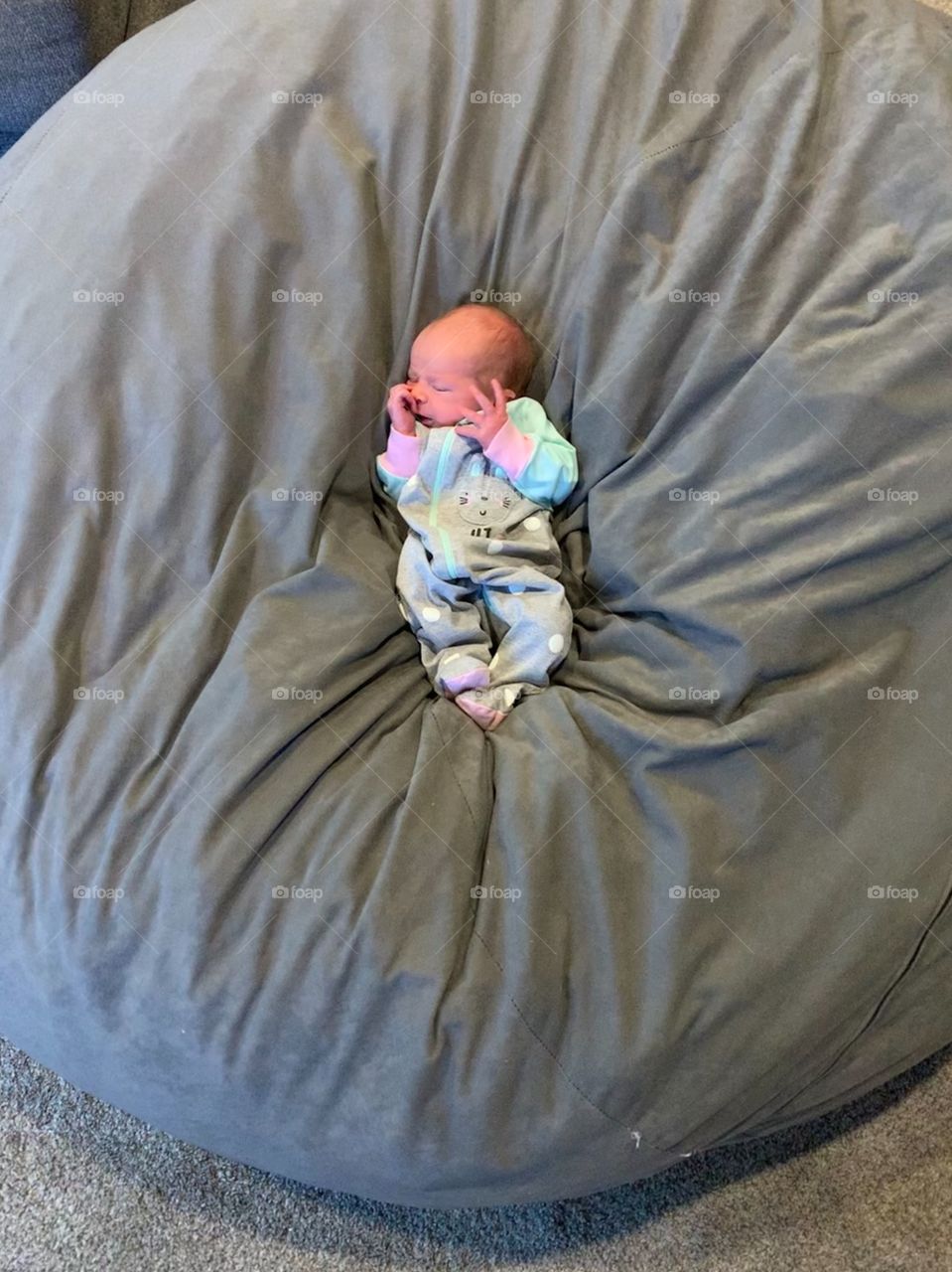 Big beanbag, little baby. Opposites attract 