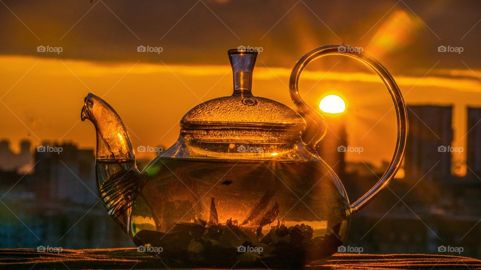 the reflection of the sun in the teapot