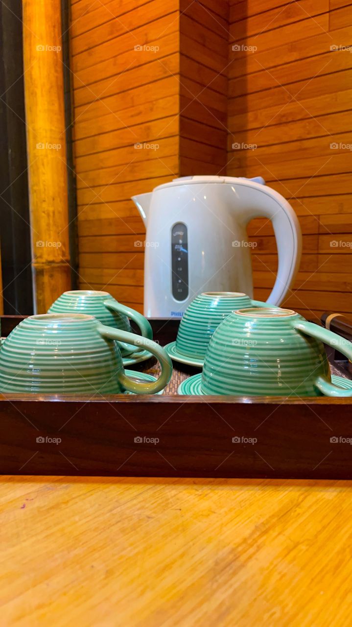Water kettle and green cups