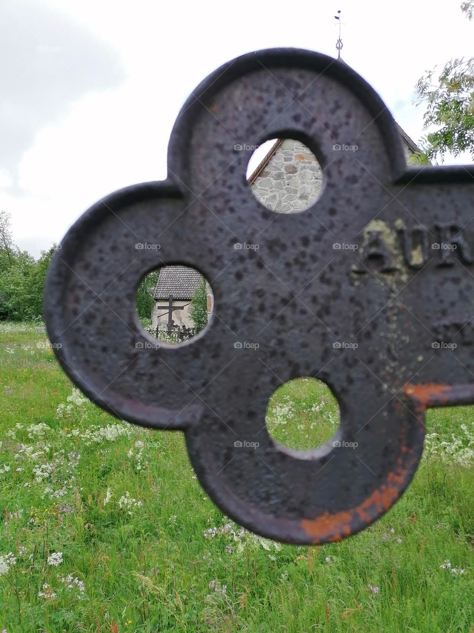 There are many old rusted iron crosses in cemeteries in Finland.