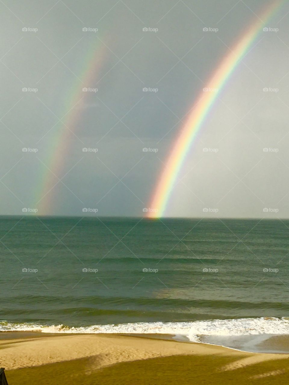 Double rainbow over the ocean