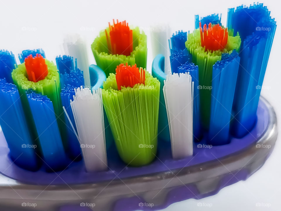 Closeup of elevated red toothbrush bristles