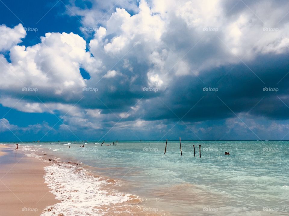 On these summer days, I like to sit by the beach and admire the infinite sea.  Here: Bruna's Beach, in Alagoas (Brazil). / Nestes dias de verão, gosto de sentar na praia e admirar o infinito do mar. Aqui: Praia da Bruna, em Alagoas (Brasil).