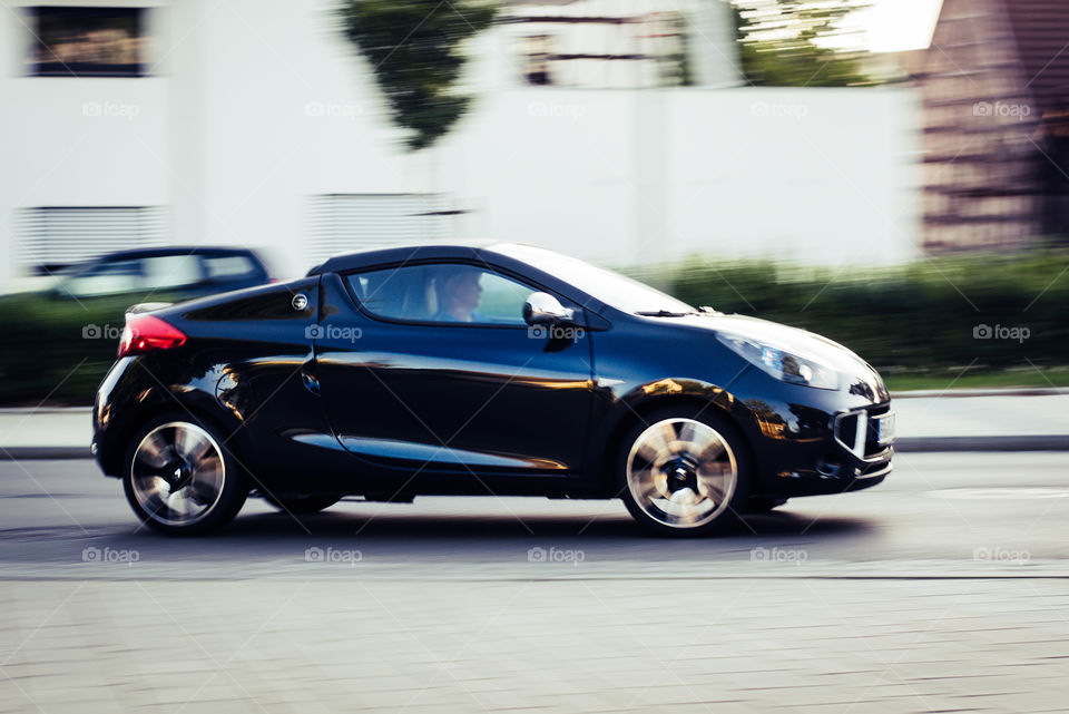 car in motion on street