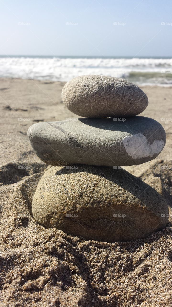 Closeup of a stack of rocks on the beach