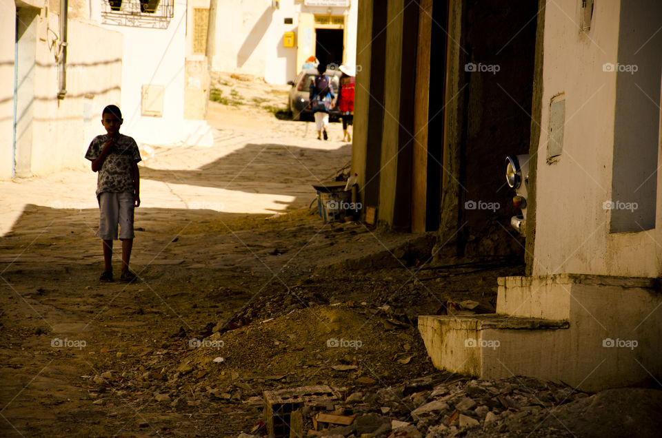 got caught shooting a picture of a child playing in the street