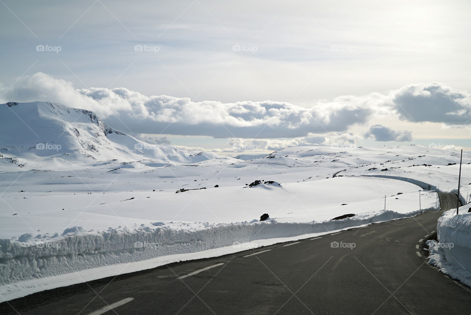 Empty road near snowy land