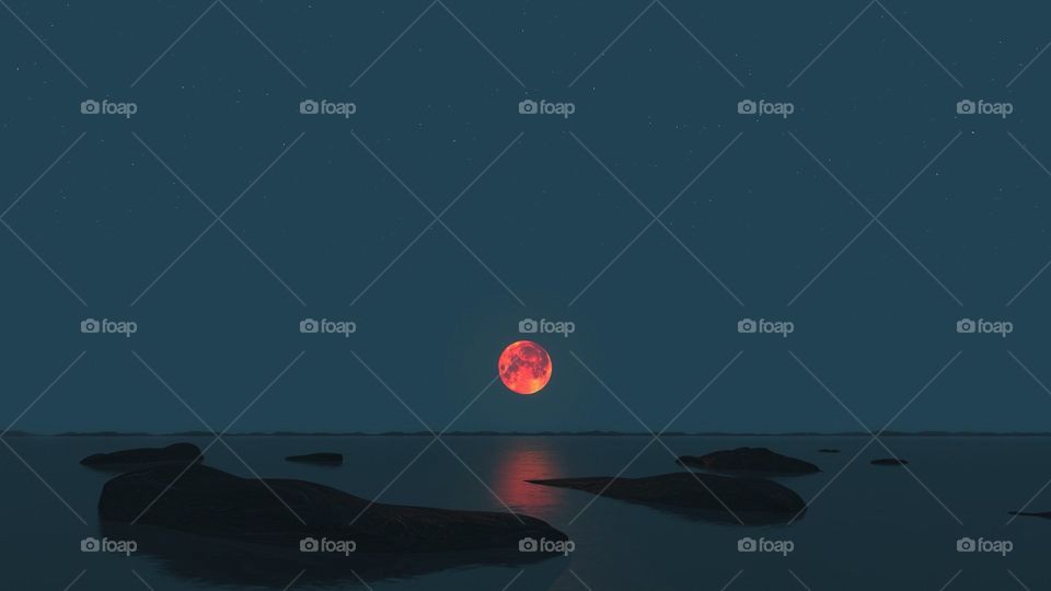 Rotleuchtender Mond über dem Meer