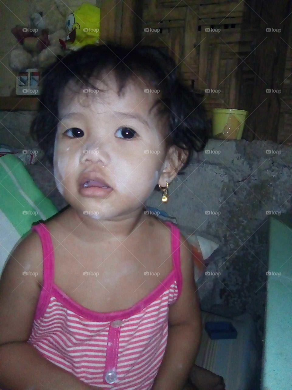 She played with the baby powder and this happened. She looked like a kid trying to imitate a character in a horror movie.