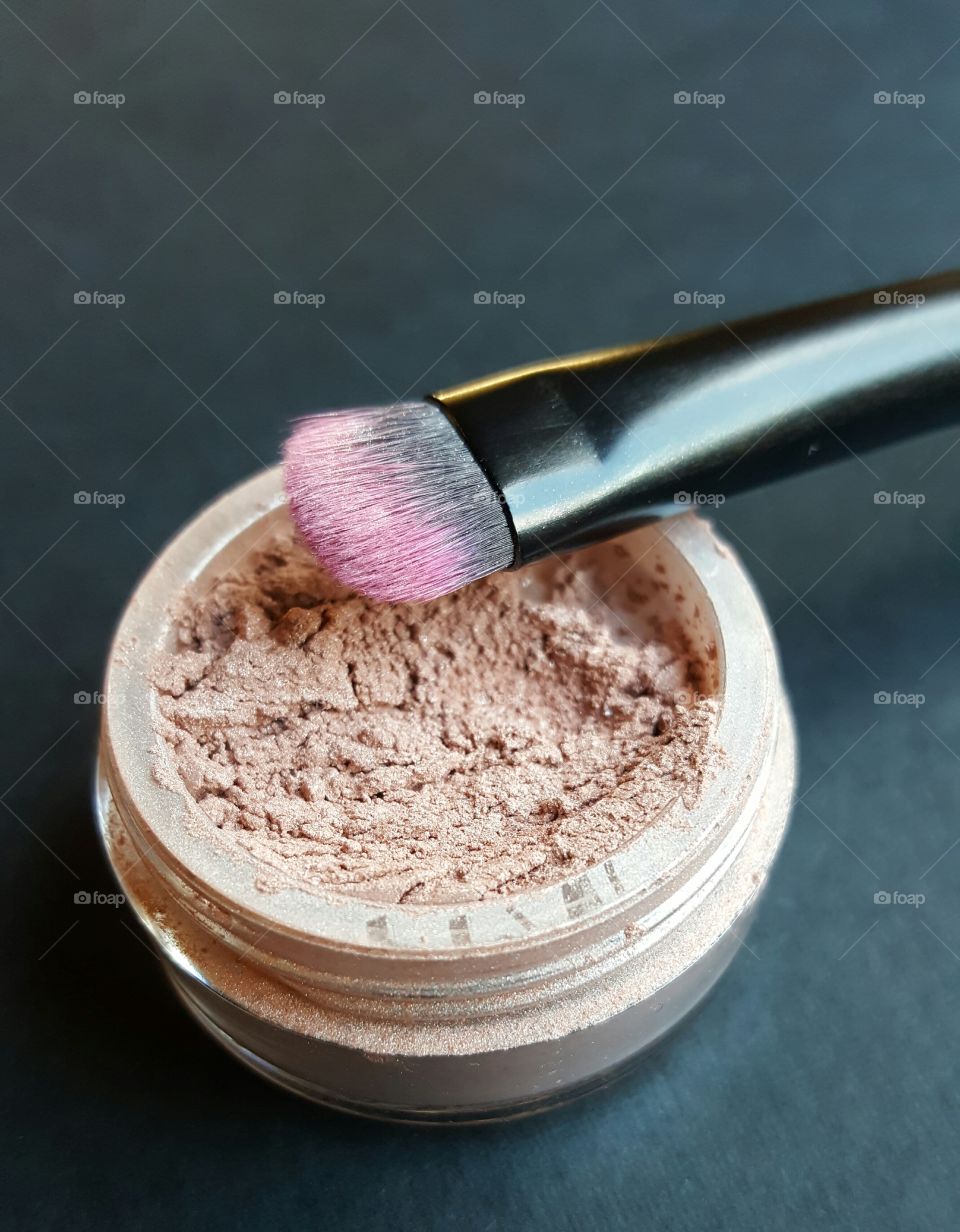 Powder eyeshadow shown with make up brush