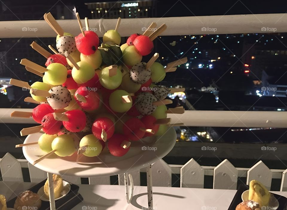 fruit stick blow at the barcony city view