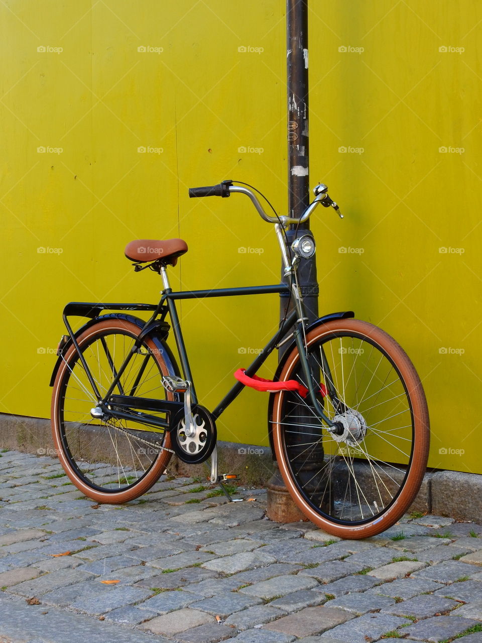 Bike by yellow wall