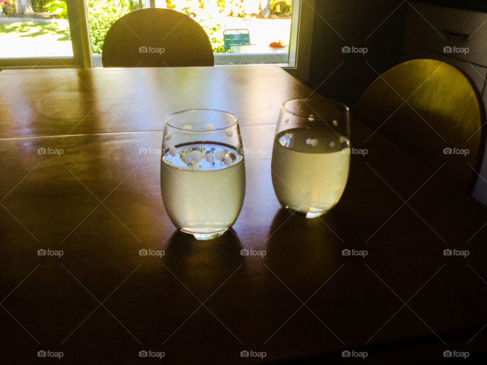 Sunlight shining through the glasses of water 