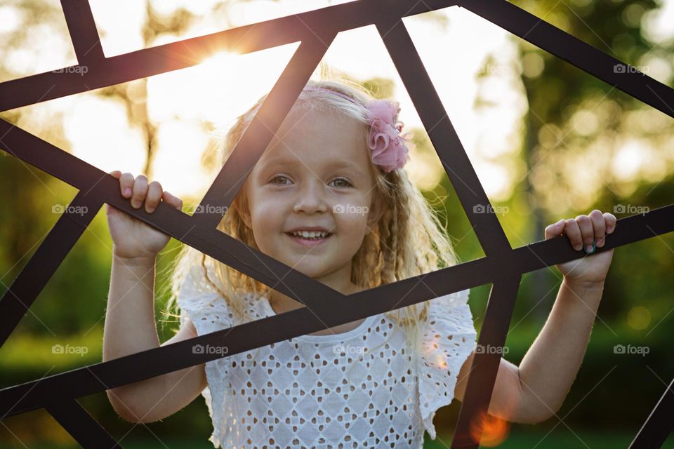 Portrait of cute happy Caucasian girl with smiley face