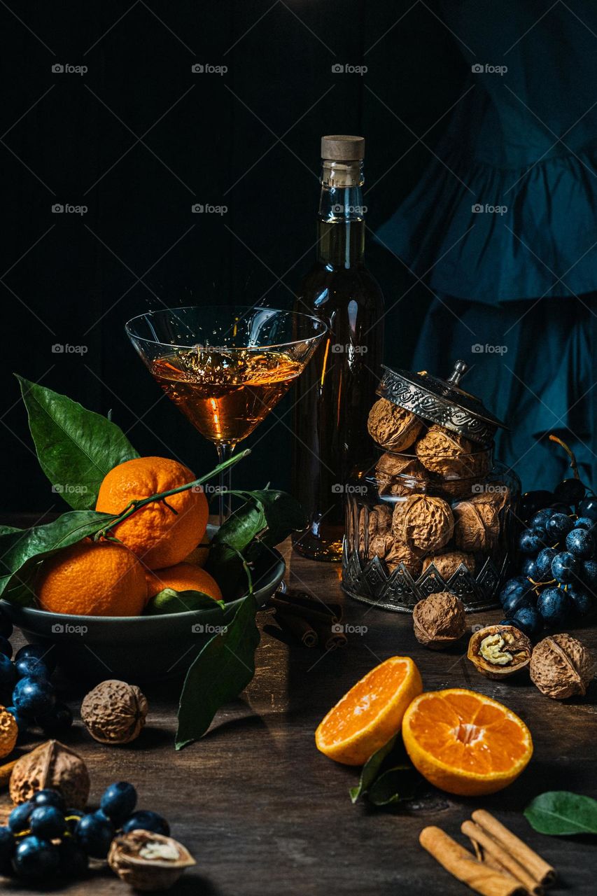 still life with tangerines, grapes and nuts