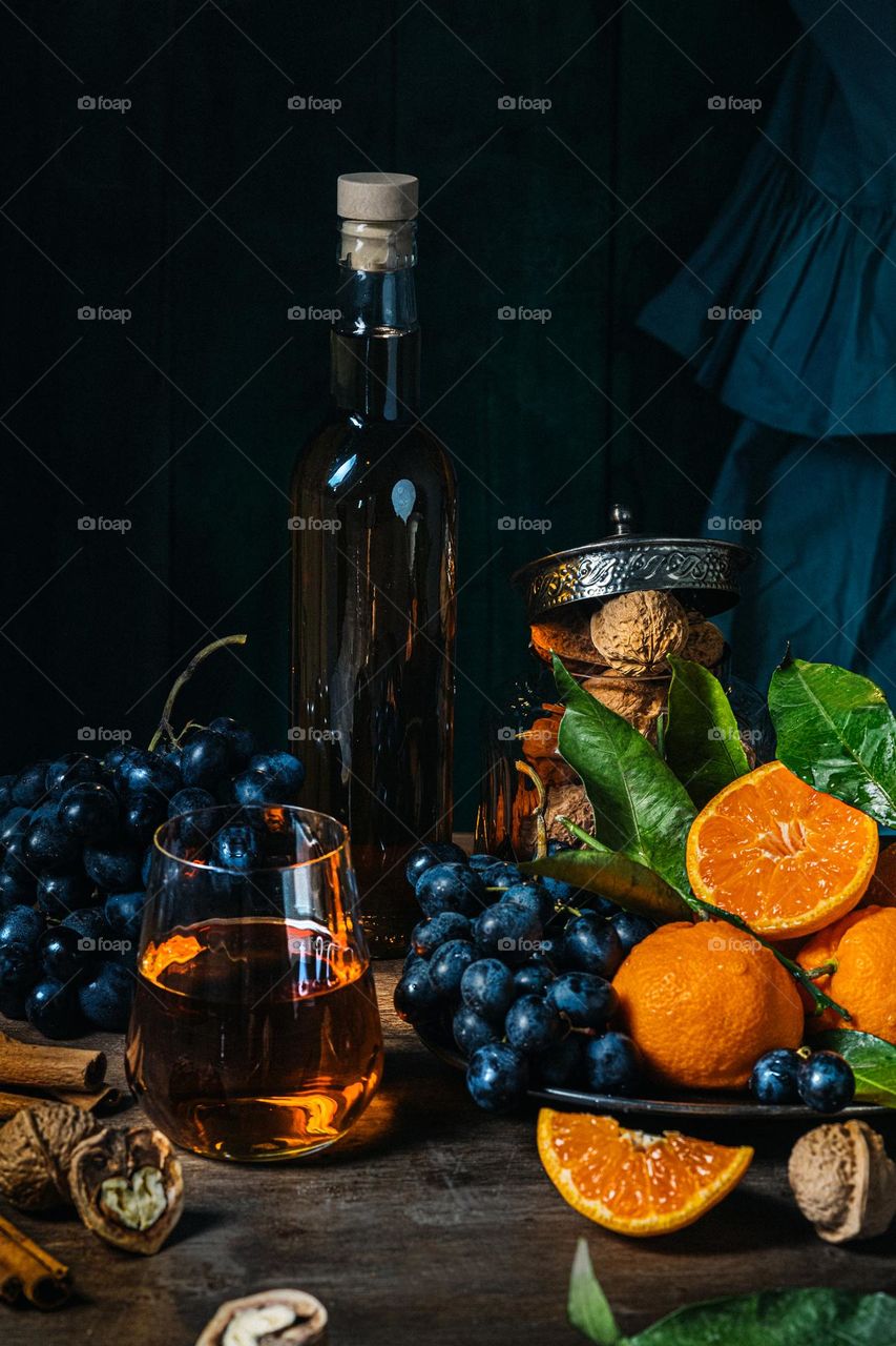 still life with tangerines, grapes and nuts