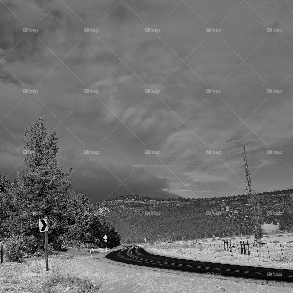 Snowy road toward mountain