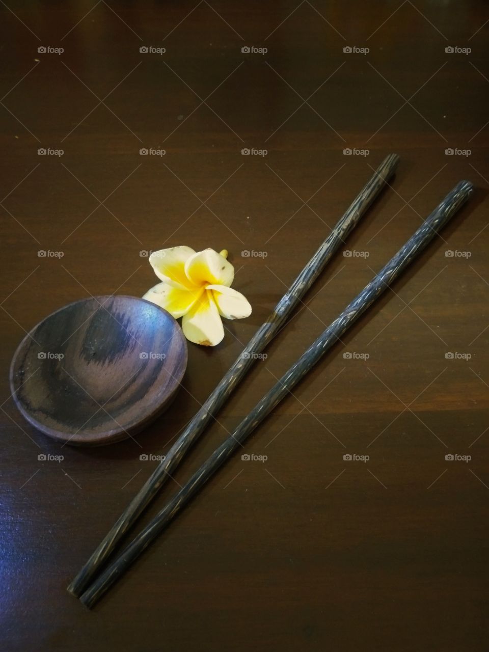 chopsticks with flowers on the table