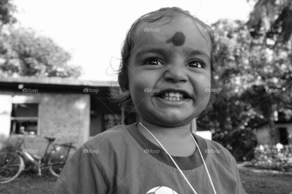 Biswanath Chariali, Assam, India : An Indian boy  child with a beautiful smile.