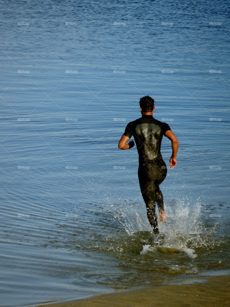 Swimmer entering the water 