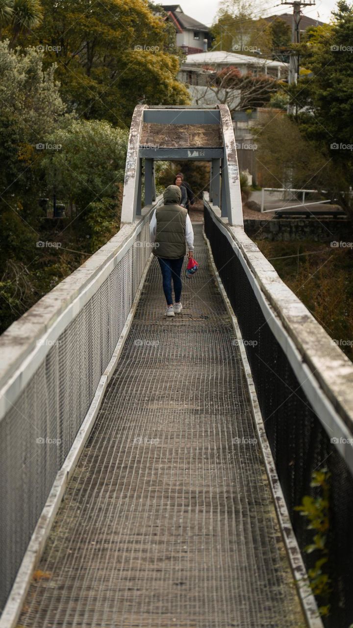 Woman walking on the bridge