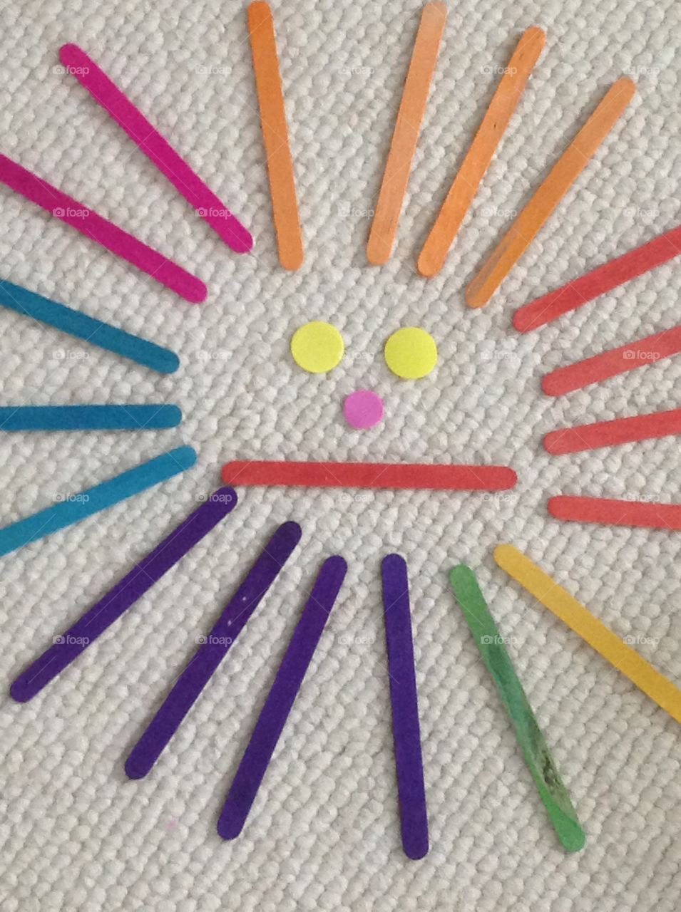 Popcicle sticks and circle stickers smiley face for arts and crafts supplies.