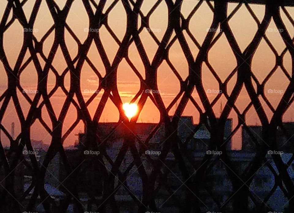 The sunrise had a heart shape, from iron window saw the sun.