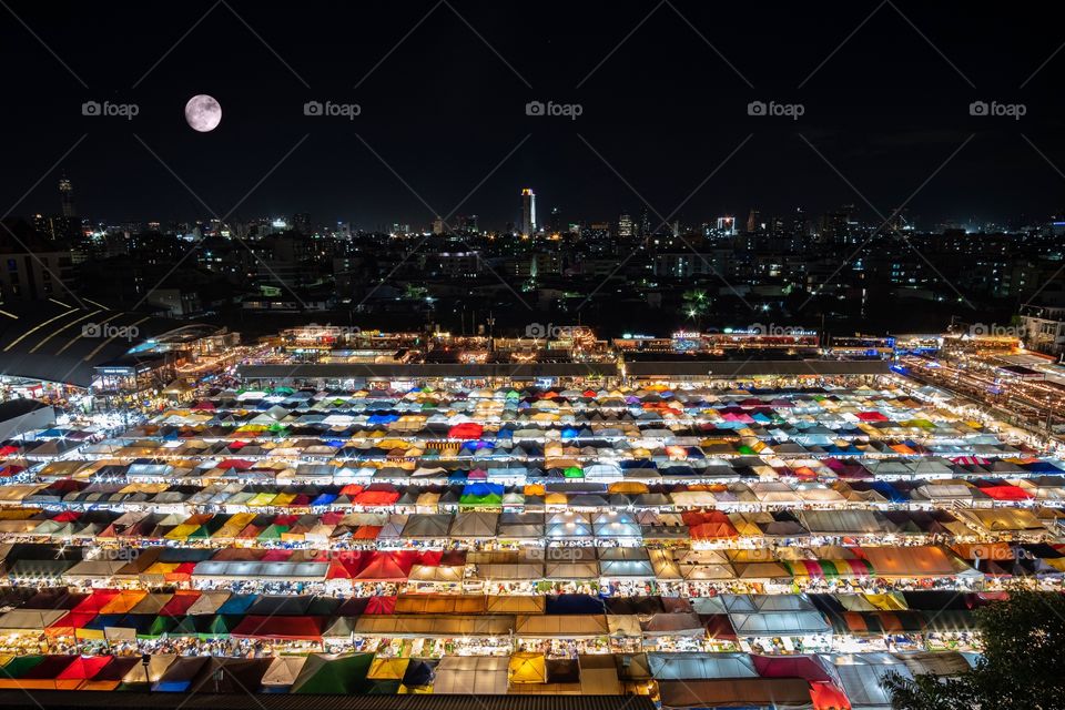 Summer is colorful time to go out all day celebrate , Many tourists are enjoying at The famous Thai night flea market , Ratchada market Bangkok Thailand