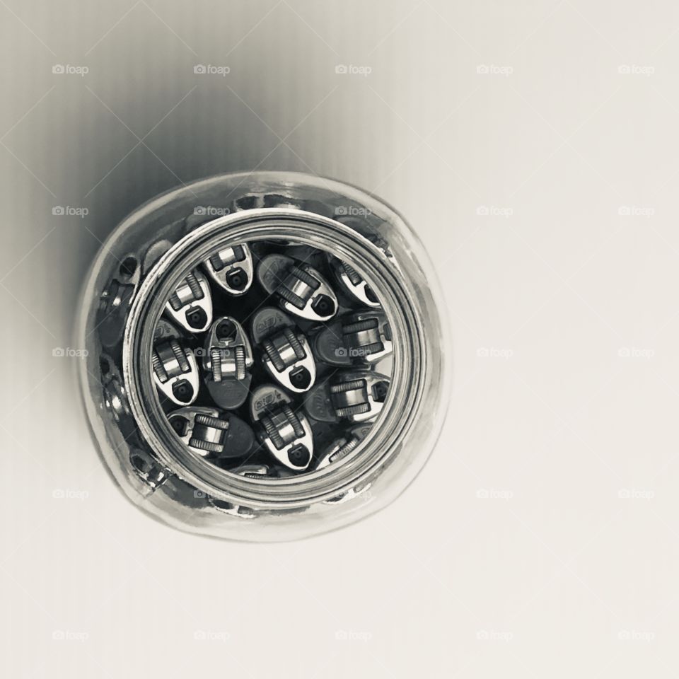 Multiple lighters inside of a jar 