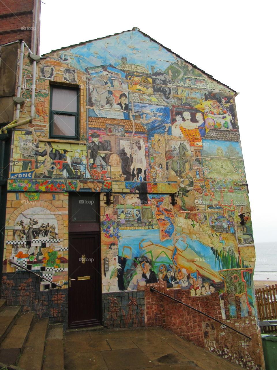 Blands cliff scarbourough north yorkshire with graffiti on building looking very colourful on a grey day