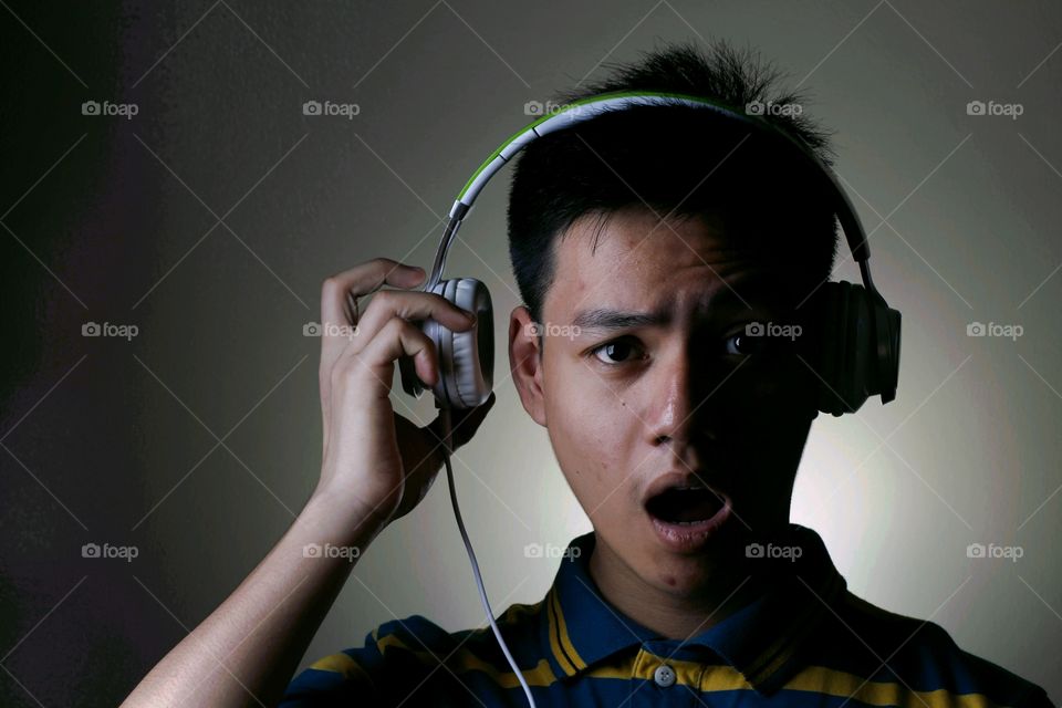 male teenager with headphones