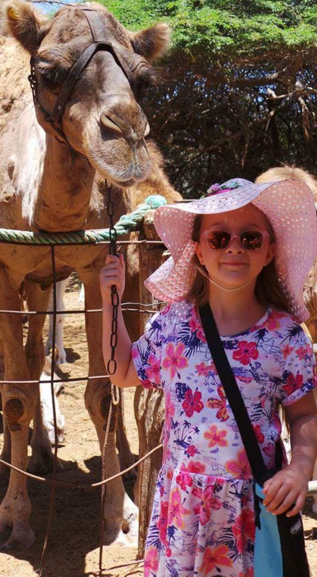 little girl with camels