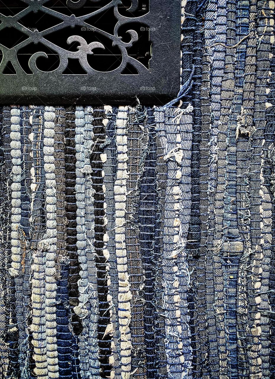 Rectangular pattern on a woven rug, little blue rectangles, geometric shapes in everyday products, rugs with geometric patterns, small blue rectangles, rectangular shapes with fabric woven into a rug