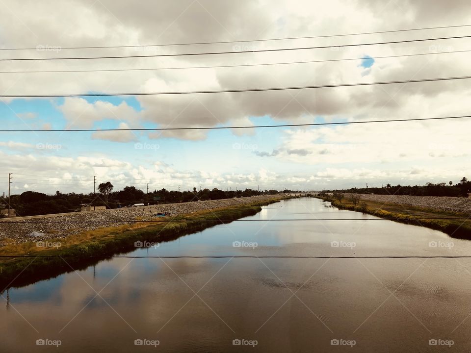 Los Angeles River & clouds in Orange County.