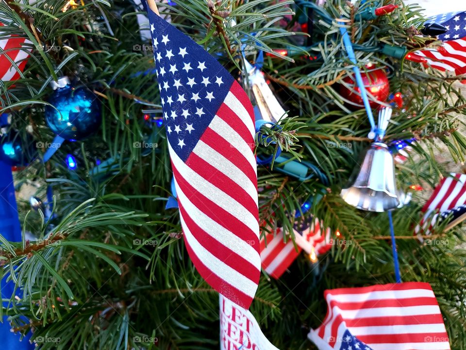 Close up of patriotic themed Christmas Tree with USA flags as ornaments