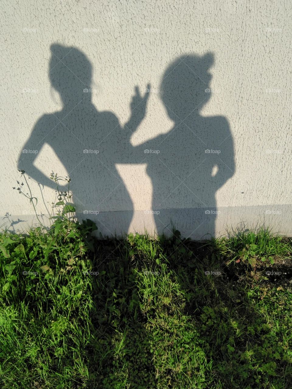 two woman's shadows, female friends