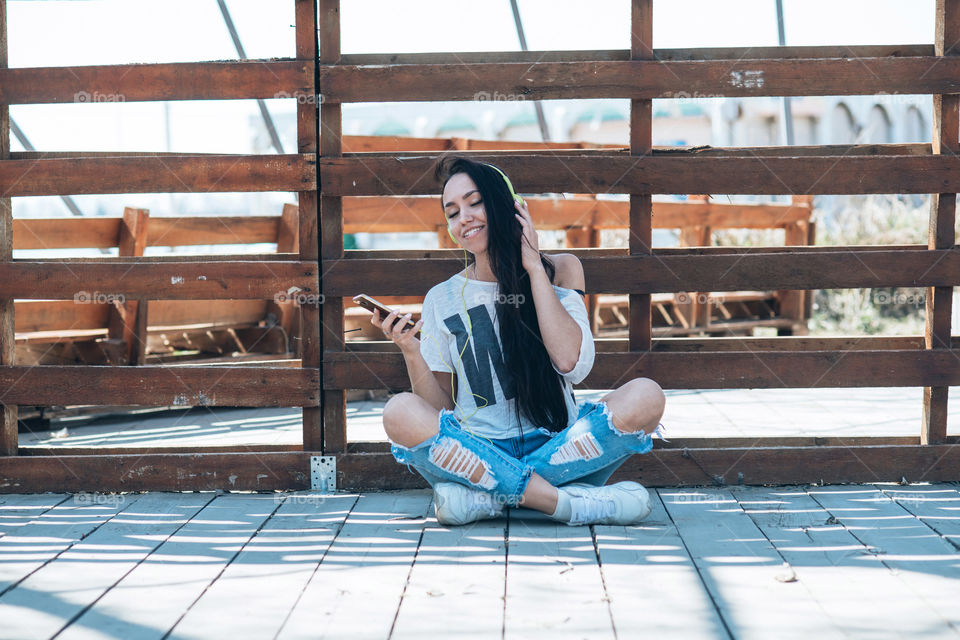 Young girl is listening to music