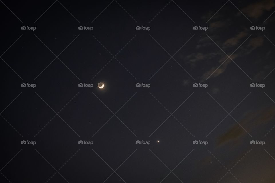 Bangkok/Thailand-November 28 2019: Phenomenon in the sky at Bangkok.The Moon,Venus star and Jupiter Star arrange to be a beautiful line on twilight moment