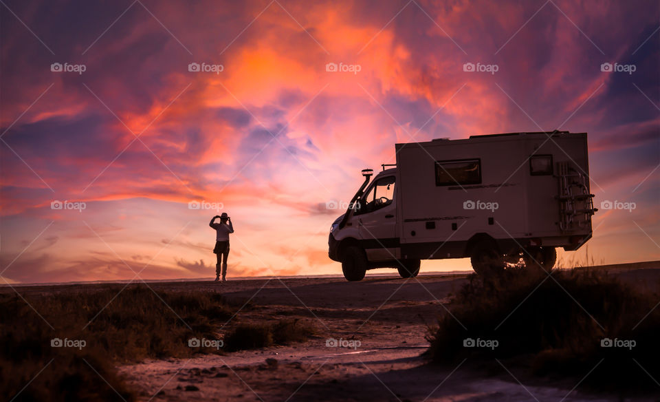 Woman Silhouette on Sunset sky 