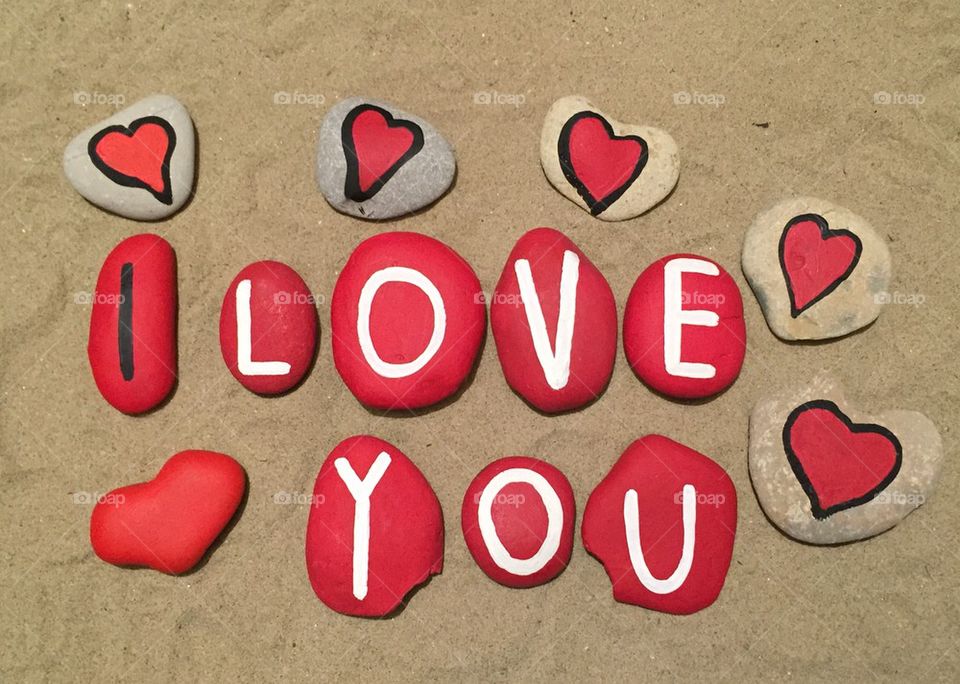 I love you, stones composition on the sand