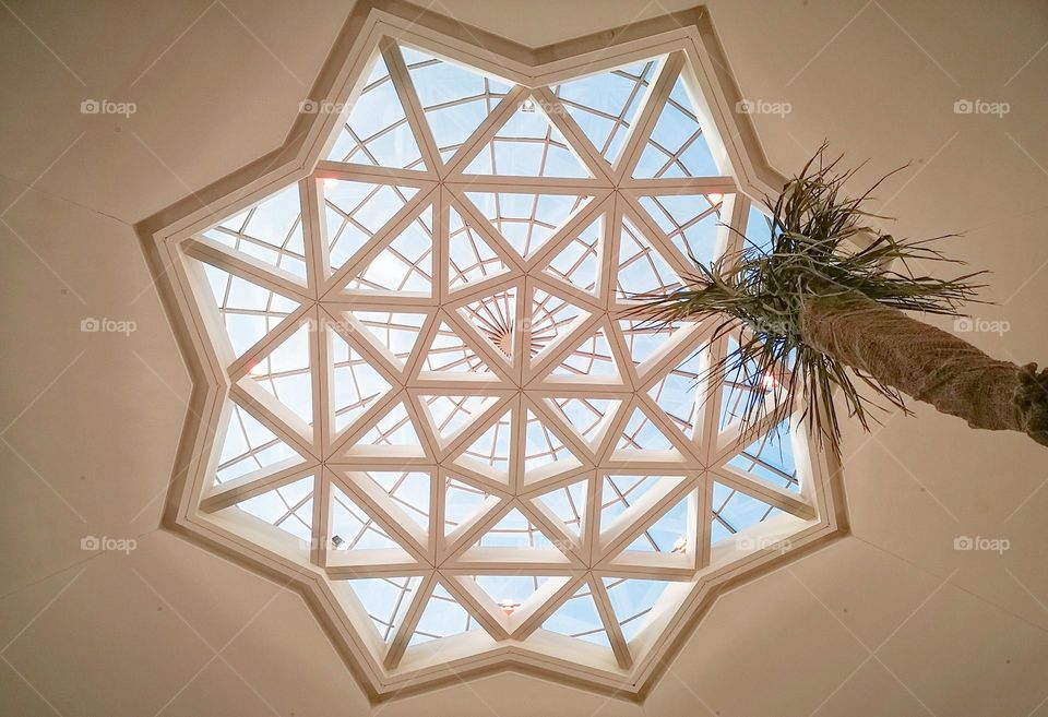 A roof designed in the form of triangles, one of the airport buildings from the inside.