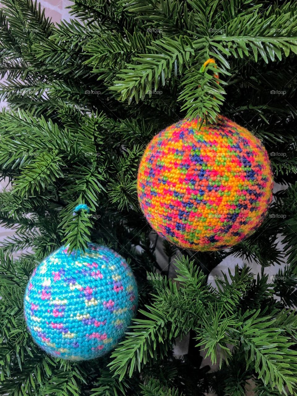 Bright multicoloured handmade crocheted Christmas tree decoration balls