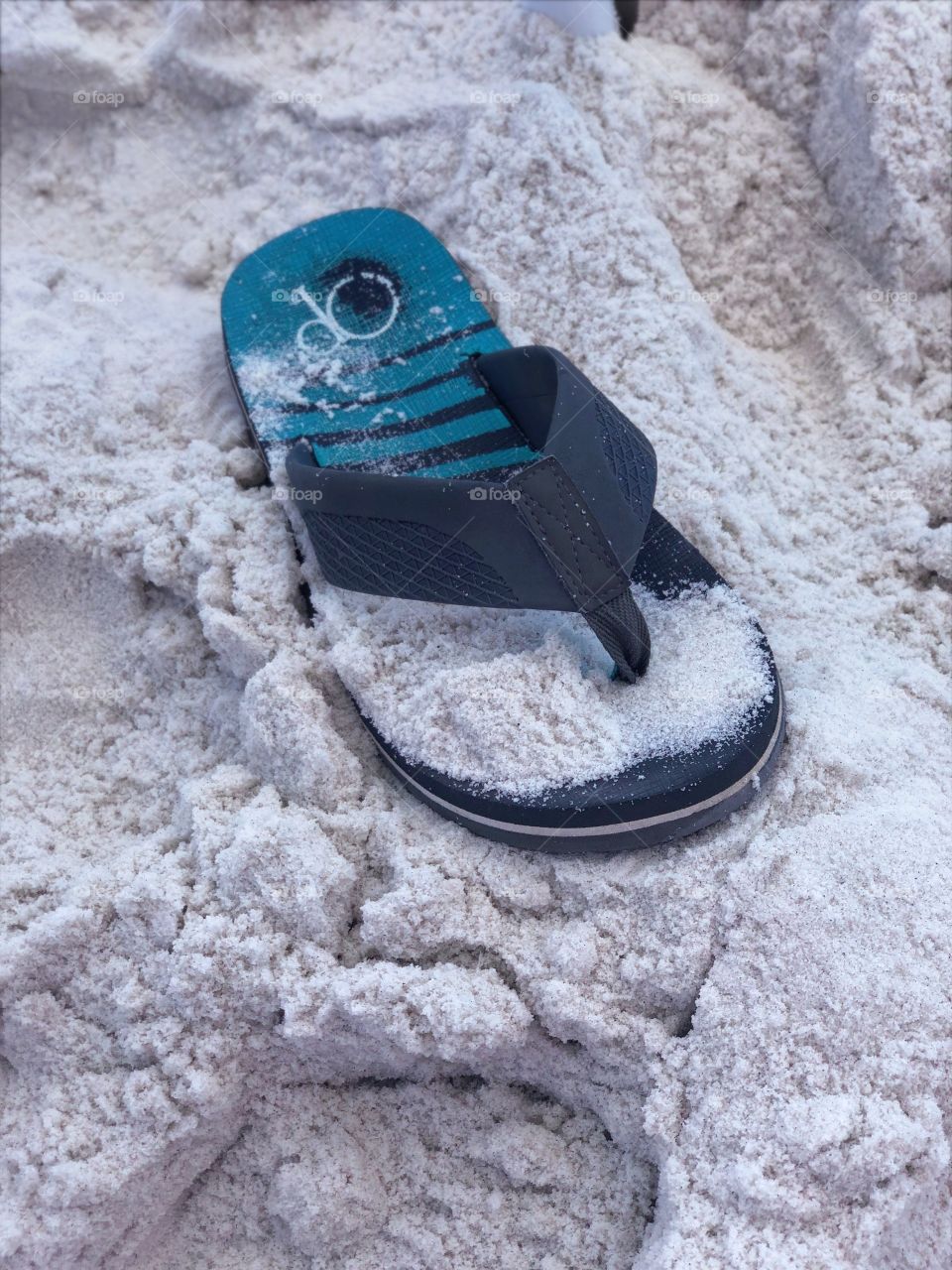 Flip flop in the sand