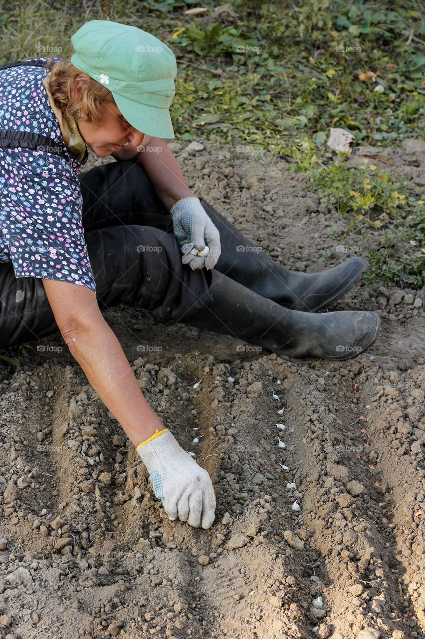 Woman planting in the garden