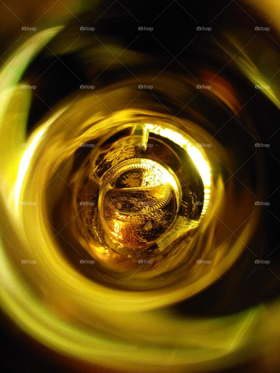 beer through a glass bottle