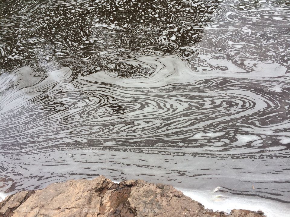 Water froth. Waterfall foam