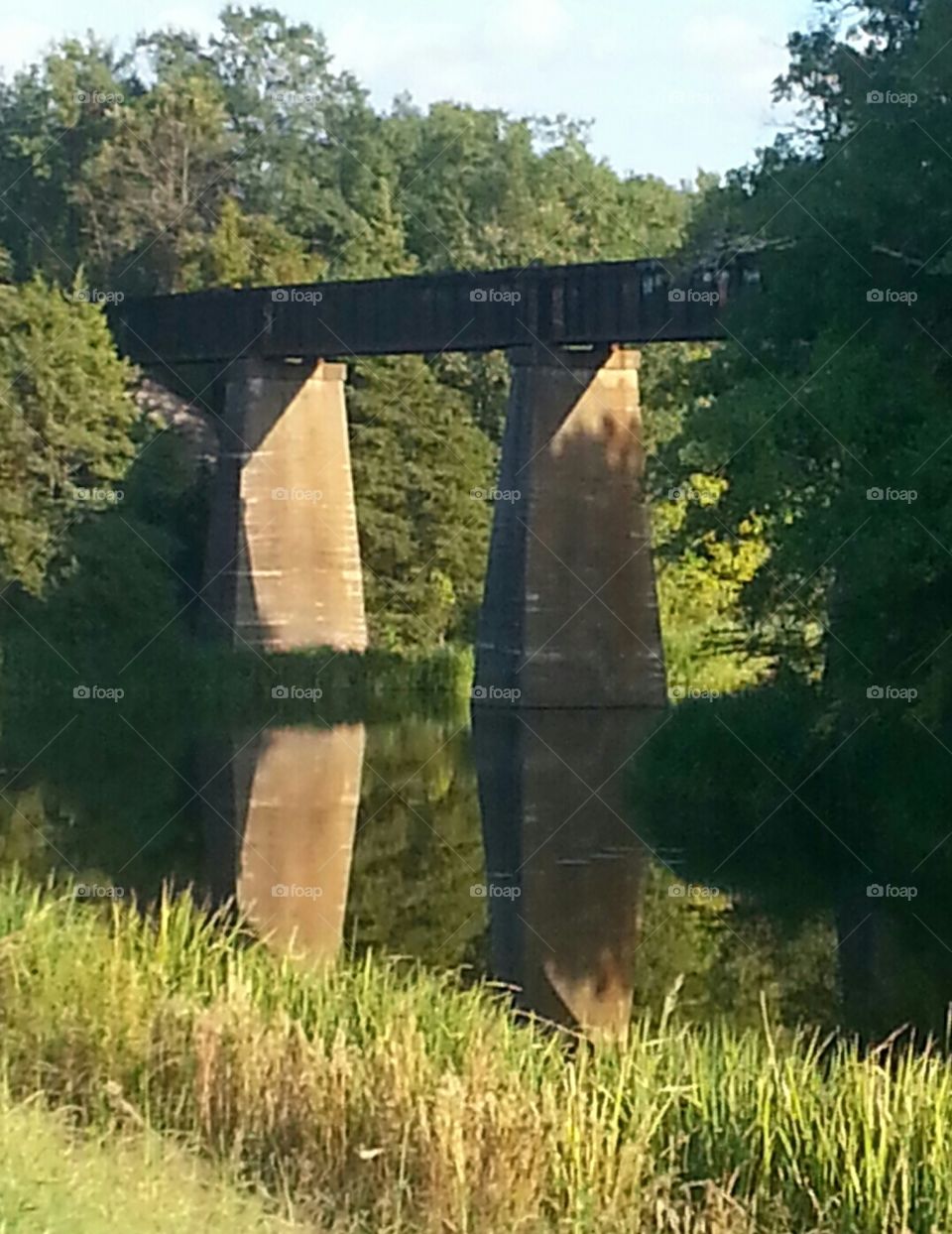 train bridge and lake reflection