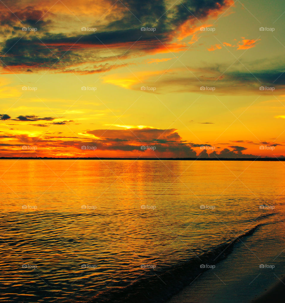 Scenic view of sea against dramatic sky